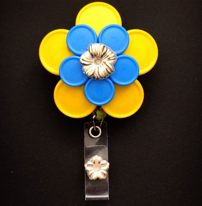 Rebecca 10 petal Yellow and Blue Flower with Gold Flower Cabachon Med Cap Vial Badge Reel