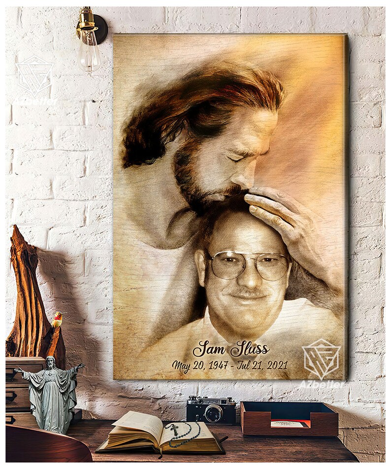 May include: A sepia-toned canvas print featuring a painting of Jesus Christ comforting a man. The man is wearing glasses and smiling. The text "Sam Sliss May 20, 1947 - Jul 21, 2021" is printed below the image.