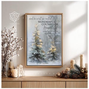May include: A framed canvas print depicting a winter scene with two illuminated Christmas trees. The artwork includes the text "and he will be called Wonderful Counsellor, Mighty God, Everlasting Father, Prince of Peace, Isaiah 9:6."