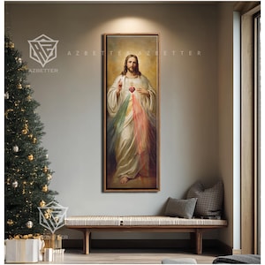 May include: A framed religious painting depicts a figure in white robes with a red heart and colorful rays of light. The artwork hangs above a wooden bench with pillows, next to a Christmas tree.