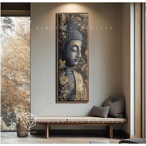 May include: A framed vertical canvas art print featuring a serene Buddha image. The artwork showcases a gray Buddha figure with gold accents, set against a dark background with floral patterns. The print is displayed above a wooden bench with pillows.