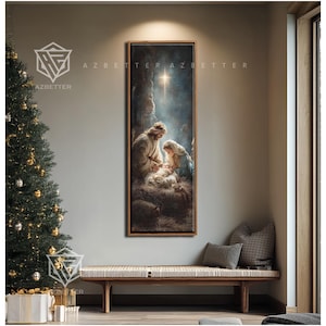 May include: A framed vertical artwork depicting the Nativity scene, with Joseph, Mary, and baby Jesus. The painting has a warm color palette with a bright star above. The artwork is displayed above a wooden bench with pillows, next to a Christmas tree.