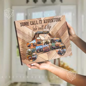 May include: Wooden wall art featuring a collage of off-road vehicles within the shape of a UTV. The artwork has a wood grain background with the text "SOME CALL IT ADVENTURE We call it life".