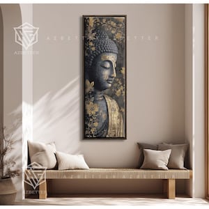 May include: A framed vertical artwork featuring a serene Buddha statue with a dark gray complexion and gold accents. The artwork is adorned with gold floral patterns and is displayed above a woven bench with neutral-colored pillows.