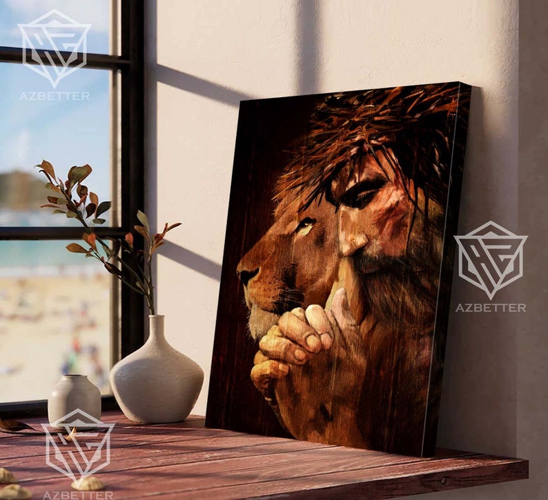 May include: A painting of a lion and a man with a crown of thorns. The lion is on the left side of the painting and the man is on the right. The lion is looking to the right and the man is looking down. The lion's mane is brown and the man's hair is brown. The background is a dark brown color.