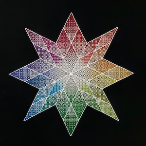 Puede incluir: Una estrella de ocho puntas colorida con un degradado arcoíris. La estrella está compuesta por muchos patrones pequeños e intrincados.
