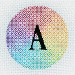 May include: A rainbow-colored circle with a black letter A in the center. The circle is made of small squares, each a different color of the rainbow.