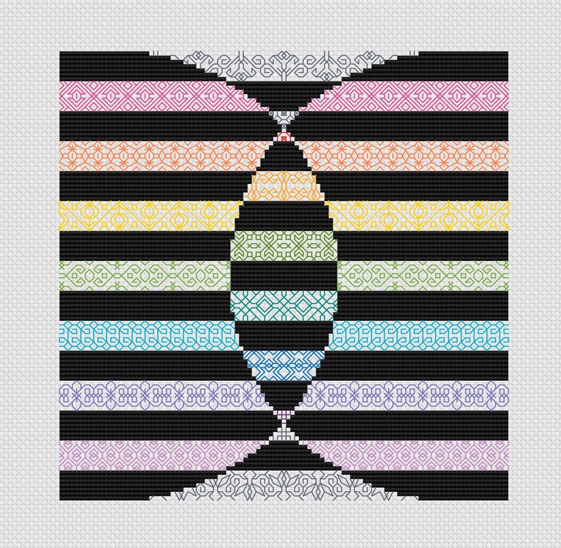 May include: A black and white geometric pattern with a rainbow of colors in the center. The pattern is made up of repeating shapes and lines.