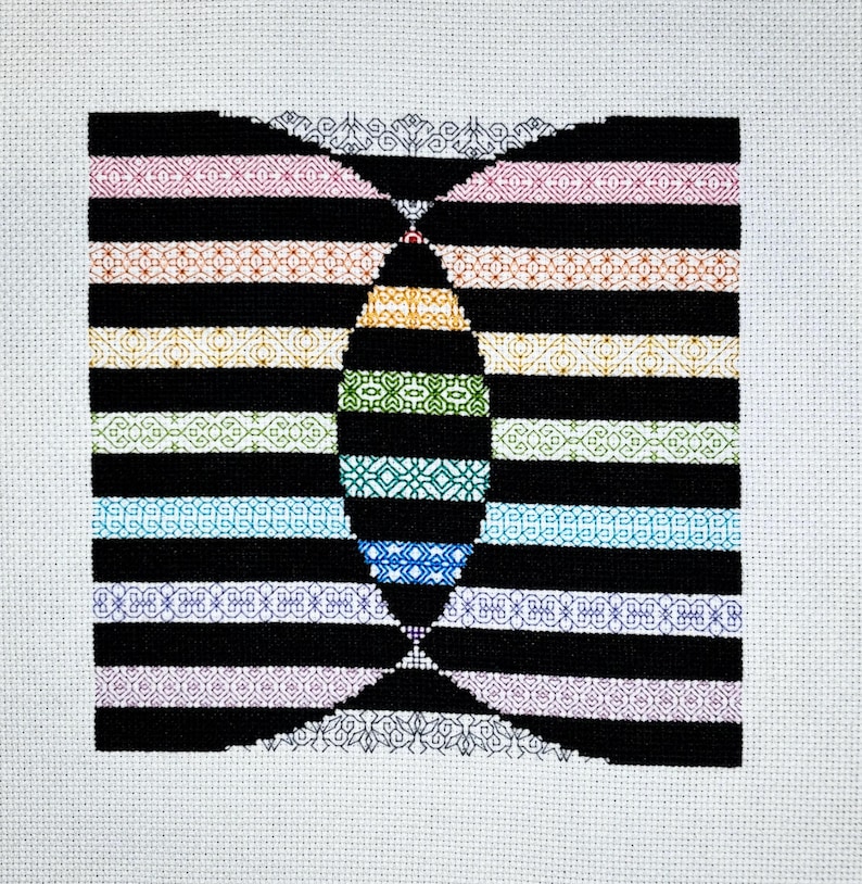 May include: A black and white cross-stitch pattern with a rainbow of colors in the center. The pattern is made up of different geometric shapes and designs.