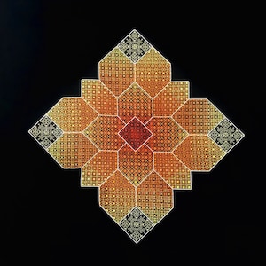 May include: A geometric pattern in shades of orange, yellow, and white on a black background. The pattern is made up of repeating squares and octagons.