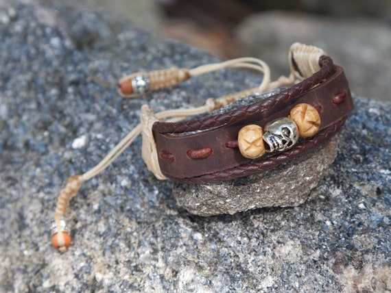 Metallic bead bracelet with brown metallic adjustable leather cord