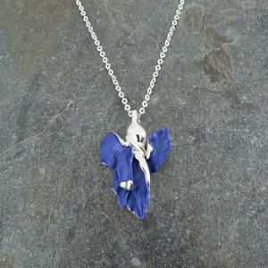 Iris blue flower pendant necklace jewellery gift by ATLondonJewels against a slate background.