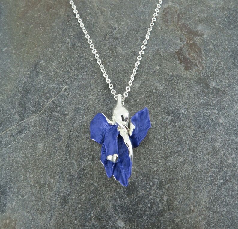 Iris blue flower pendant necklace jewellery gift by ATLondonJewels against a slate background.