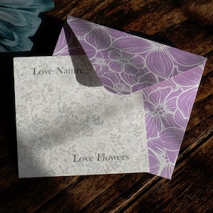 ATLondonJewels Jewellery Fully Recyclable Packaging. A Pretty lilac envelope with the jewellery presentation card placed on top, with the words Love Nature Love Flowers