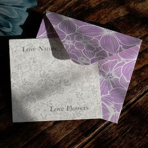 ATLondonJewels Jewellery Fully Recyclable Packaging. A Pretty lilac envelope with the jewellery presentation card placed on top, with the words Love Nature Love Flowers