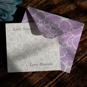 ATLondonJewels Jewellery Fully Recyclable Packaging. A Pretty lilac envelope with the jewellery presentation card placed on top, with the words Love Nature Love Flowers