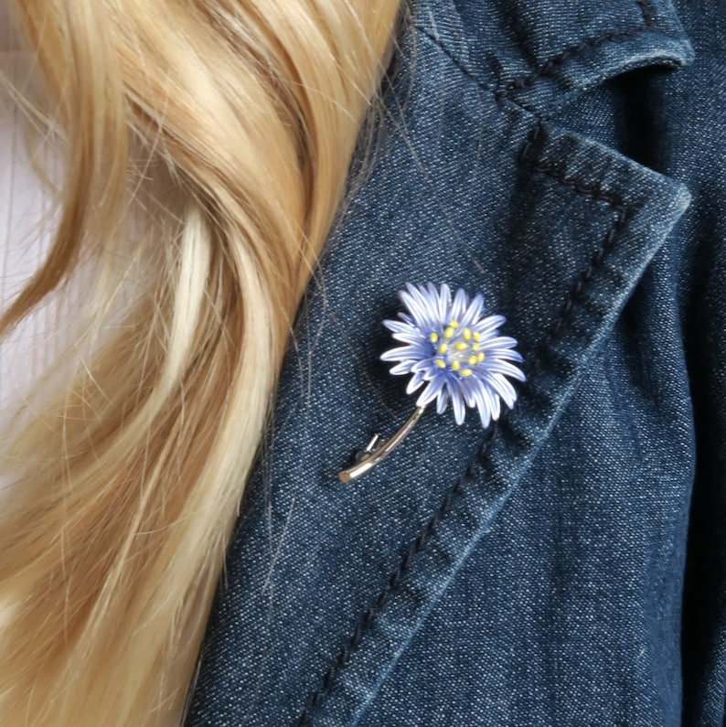 Aster blue flower brooch jewellery gift by ATLondonJewels, on a blue denim jacket lapel.