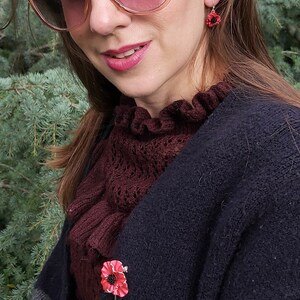 ATLondonJewels Poppy Red Flower Brooch worn on a black wool coat on a model