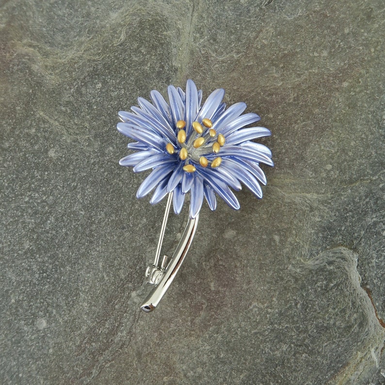 Aster blue flower brooch jewellery gift by ATLondonJewels, on a slate background.