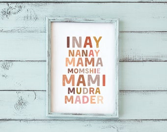 May include: A framed print with the words "INAY", "NANAY", "MAMA", "MOMSHIE", "MAMI", "MUDRA", and "MADER" in different colors and fonts.