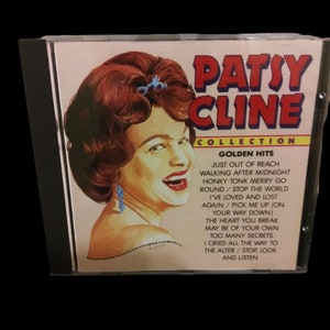 May include: A CD case with a colorful illustration of Patsy Cline on the front. The title "Patsy Cline Collection" is printed in large, bold letters above the image. The text "Golden Hits" is printed in a smaller font below the image, followed by a list of song titles.
