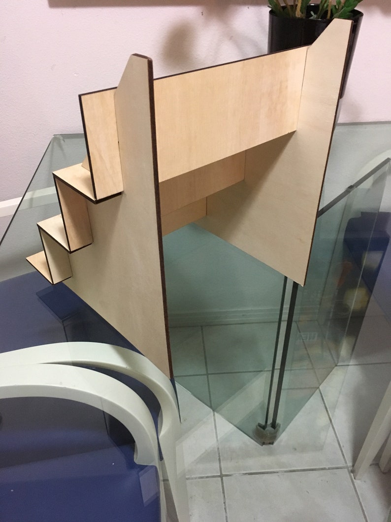 May include: A wooden tiered display stand with four shelves. The stand is made of light wood with a natural finish. The shelves are rectangular and have a slight lip to prevent items from falling off. The stand is ideal for displaying small items, such as jewellery, cosmetics, or crafts.