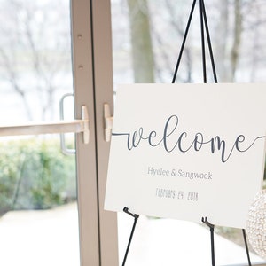 White Cursive Wedding Welcome Sign