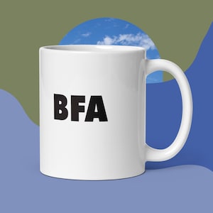 May include: White ceramic coffee mug with a black inscription that reads "BFA".