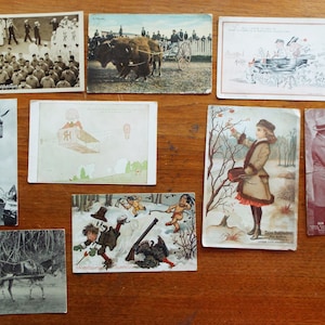 Lote de 8 postales antiguas con temas variados + 1 caza de cartas comerciales