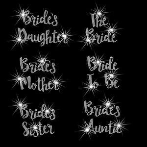 May include: Six rhinestone designs for a wedding party. The designs read "Bride's Daughter", "The Bride", "Bride's Mother", "Bride to Be", "Bride's Sister", and "Bride's Auntie".