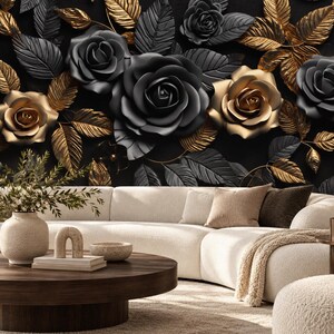May include: A curved white sofa with textured fabric sits before a wall featuring a large-scale floral mural of matte black and metallic gold roses and leaves. A round dark wood coffee table holds a ceramic vase, a small arch, and a bowl.