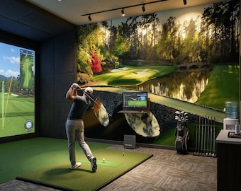 May include: An indoor golf simulator room featuring a large wall mural of a golf course, a green turf mat, a golf bag with clubs, a digital display screen, and a person swinging a golf club toward a projected virtual course.