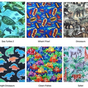 May include: A collection of six fabric swatches featuring various patterns: sea turtles in blue water, comic book sound effects, prehistoric dinosaurs, colorful outlined dinosaurs on black, clownfish in green seaweed, and safari animals.