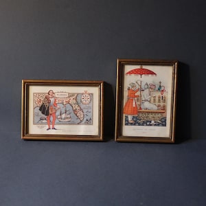 conjunto de 2 molduras douradas vintage, feitas à mão em madeira com estampas vintage originais com coleção de piratas, corsários e navegadores dos anos 70