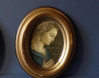 Vintage oval frame in Neapolitan wood with gold background and antique effect craquelé and silkscreen of the Madonna Lippina