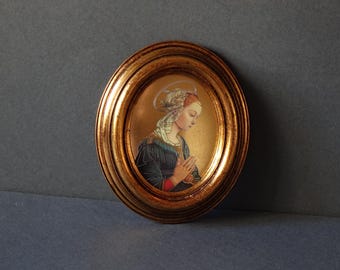 Pair of vintage oval frames in Neapolitan wood with gold background and antique effect craquelure and silkscreens of the Madonna Lippina painting
