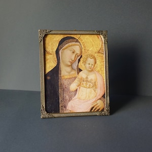 Vintage frame with print of the Madonna and Child, the frame is in silver-plated metal from the 70s