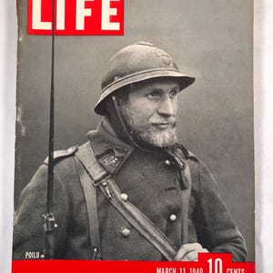 May include: Vintage LIFE magazine cover from March 11, 1940, featuring a portrait of a soldier in uniform. The cover has a red banner with the text "LIFE" and the price "10 Cents". The soldier wears a helmet and a military coat.