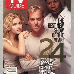May include: TV Guide magazine cover featuring actors Elisha Cuthbert, Kiefer Sutherland, and Dennis Haysbert from the TV show "24". The cover features the show's title "24" in large gold letters and the tagline "He's got one day to save his family and protect his country. The clock is ticking..."