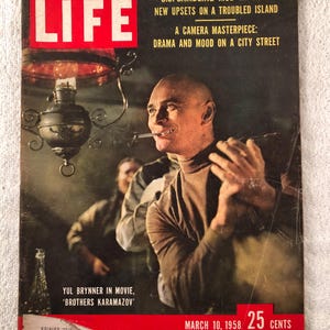 May include: Vintage LIFE magazine cover featuring Yul Brynner from the movie 'Brothers Karamazov'. The cover has a red banner with the text 'LIFE' in white, and headlines about Cuba and a camera masterpiece. The issue date is March 10, 1958, and the price is 25 cents.