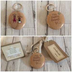 May include: Wooden keychain with a heart and the text "This Daddy Belongs to..."  The keychain is in a small hessian bag with a tag that says "Handmade with love".