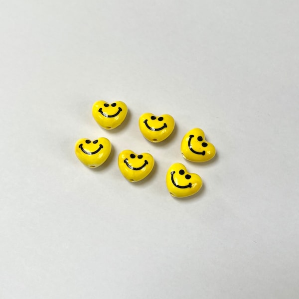 Yellow clay smiley face heart beads (set of 6)