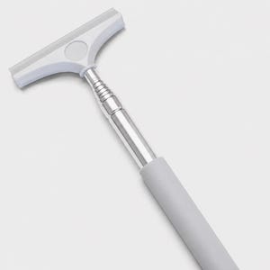 May include: A squeegee featuring a white T-shaped head with a flexible blade, a silver-colored telescopic metal handle with multiple segments, and a solid light gray cylindrical grip at the base of the handle for manual operation.