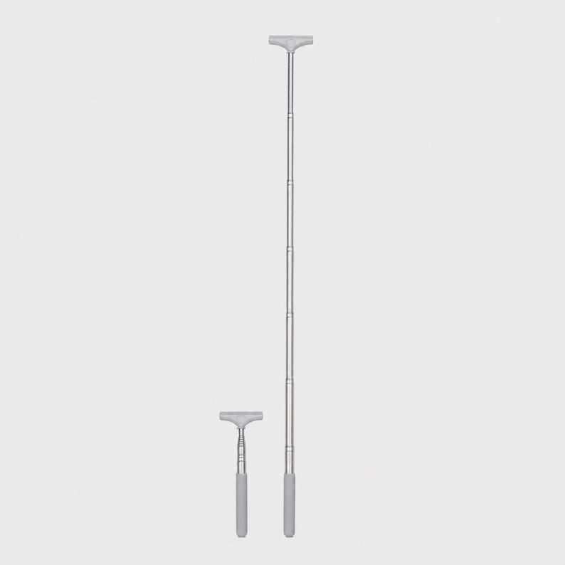 May include: Two silver-colored telescopic poles with T-shaped handles. One pole is shown in a fully retracted, short position, while the other is fully extended to a much longer length. Both feature a smooth metallic finish and a gray grip handle.