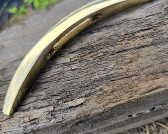 Brass curved crossguard with tapered ends