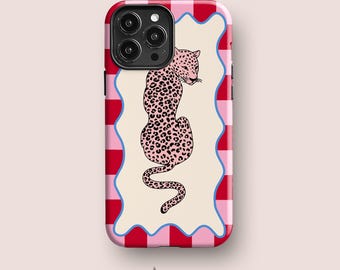 May include: A rectangular phone case featuring a central cream-colored panel with a wavy blue border. The panel displays a pink leopard with black spots. The outer edges of the case are decorated with a vertical pattern of alternating red and pink stripes.