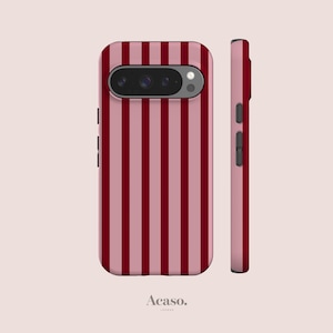 May include: A smartphone case featuring a vertical striped pattern in alternating shades of dark red and dusty pink. The case includes a horizontal camera cutout at the top with visible lenses and a side view showing black buttons and the brand name Acaso.