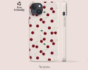 May include: A phone case with a speckled off-white base featuring a repeating pattern of dark red cherries with green stems. The case includes a camera cutout and side button covers. The text Eco Friendly and Acaso. London are visible.