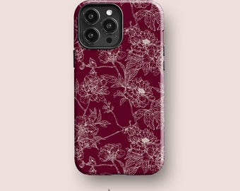 May include: A deep burgundy smartphone case featuring a white line-art floral pattern of blooming peonies and leaves. The case has a rectangular shape with rounded corners and a cutout for a triple-lens camera system on the upper left side.