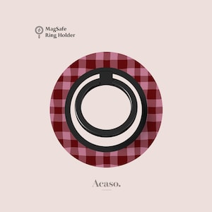 May include: A circular MagSafe ring holder featuring a dark red and light pink gingham plaid pattern. The device has a black central ring mechanism. The text MagSafe Ring Holder and Acaso. LONDON are printed on the light pink background.